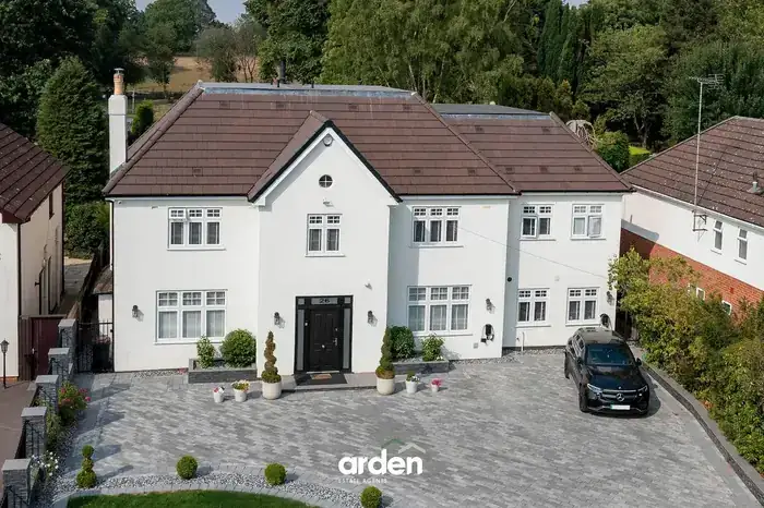 Aerial view of the finished house and driveway