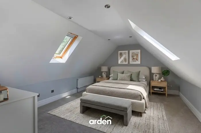 Loft bedroom with velux windows in the eaves