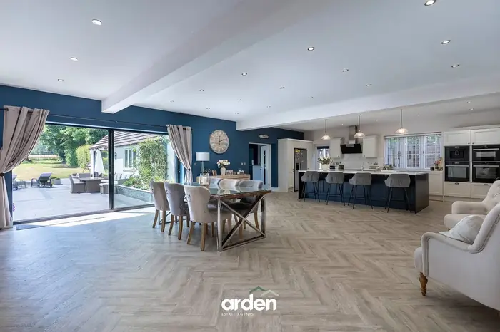 Open plan kitchen and dining room with sliding doors to the garden