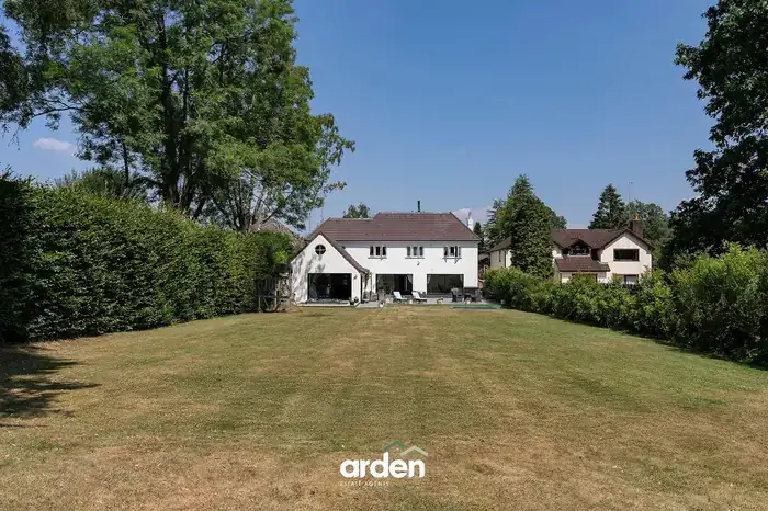 The rear of the house seen from the far end of the lawn